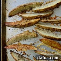 Black Pepper Parmesan Frico Potato Wedges on a plate