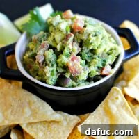 Smoky Blue Guac Perfection 24 Bacon Gorgonzola Guacamole in a bowl with tortilla chips