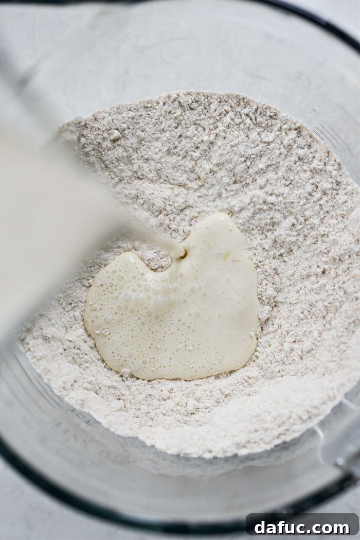 Pouring wet ingredients into dry ingredients