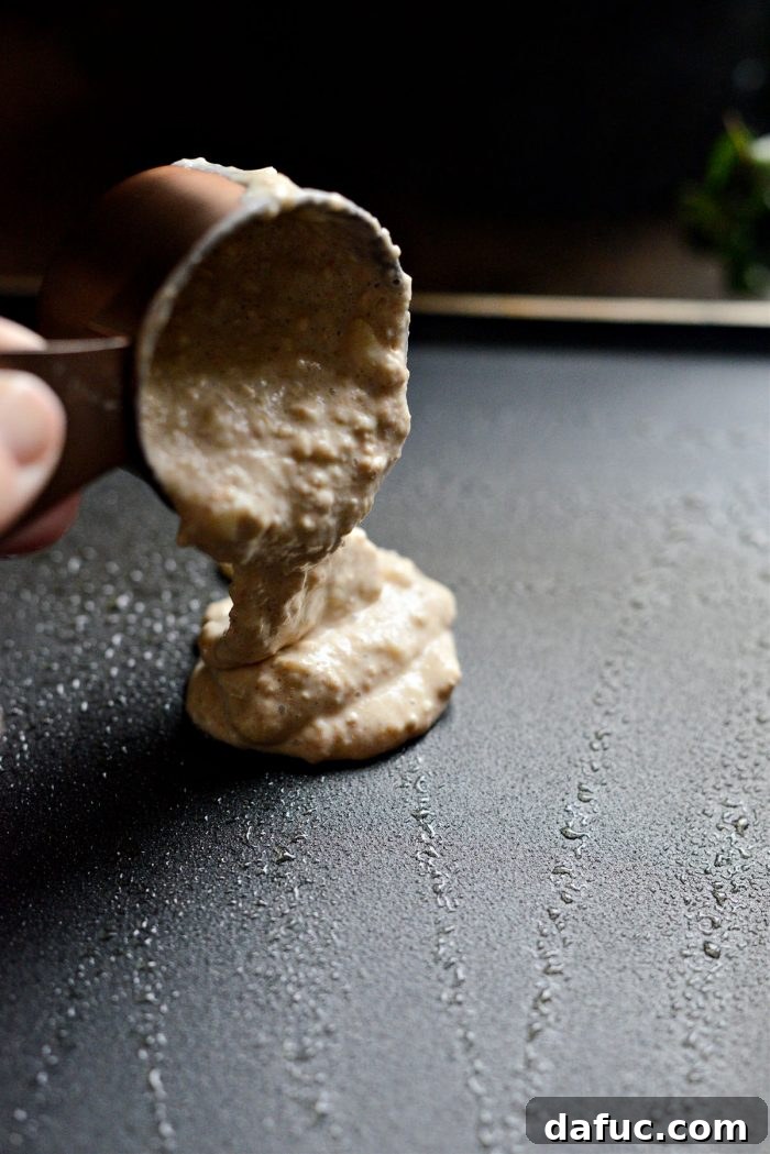 Pouring pancake batter onto a hot griddle