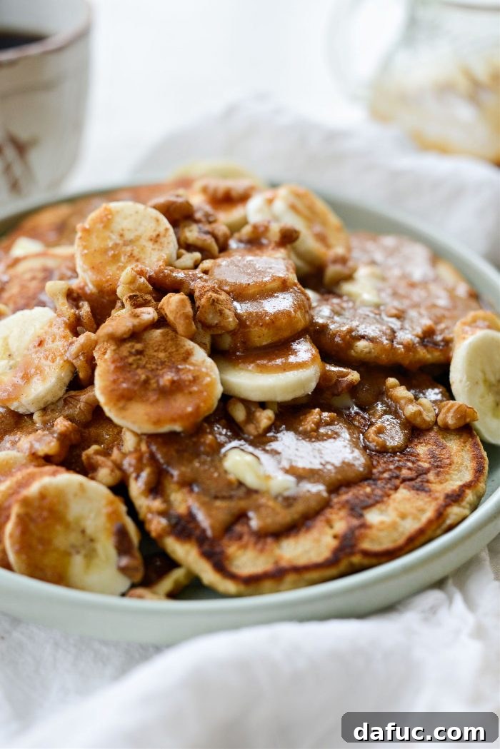 A close-up of a plate of Peanut Butter Oatmeal Banana Pancakes ready to be served