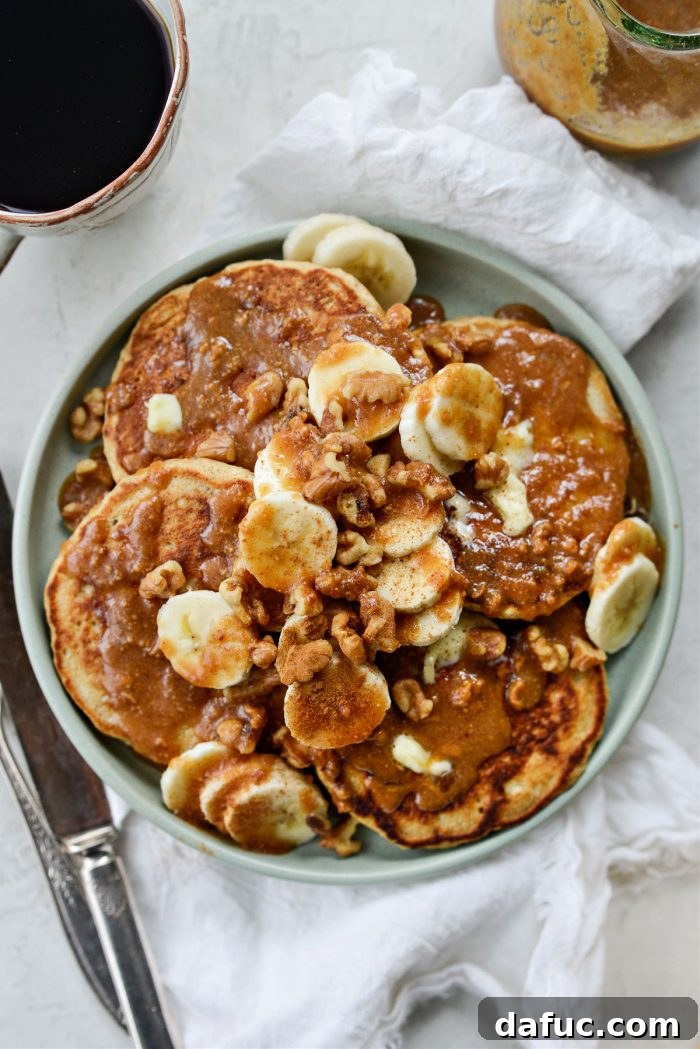 A final close-up shot of Peanut Butter Oatmeal Banana Pancakes garnished and ready to eat