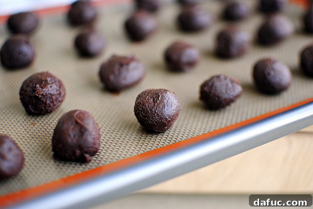 Mystic Mayan Truffles 14 Rolling truffle mixture into small, uniform balls