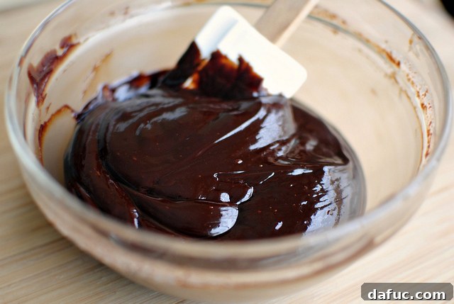 Mystic Mayan Truffles 9 Stirring melted chocolate and cream until smooth and glossy