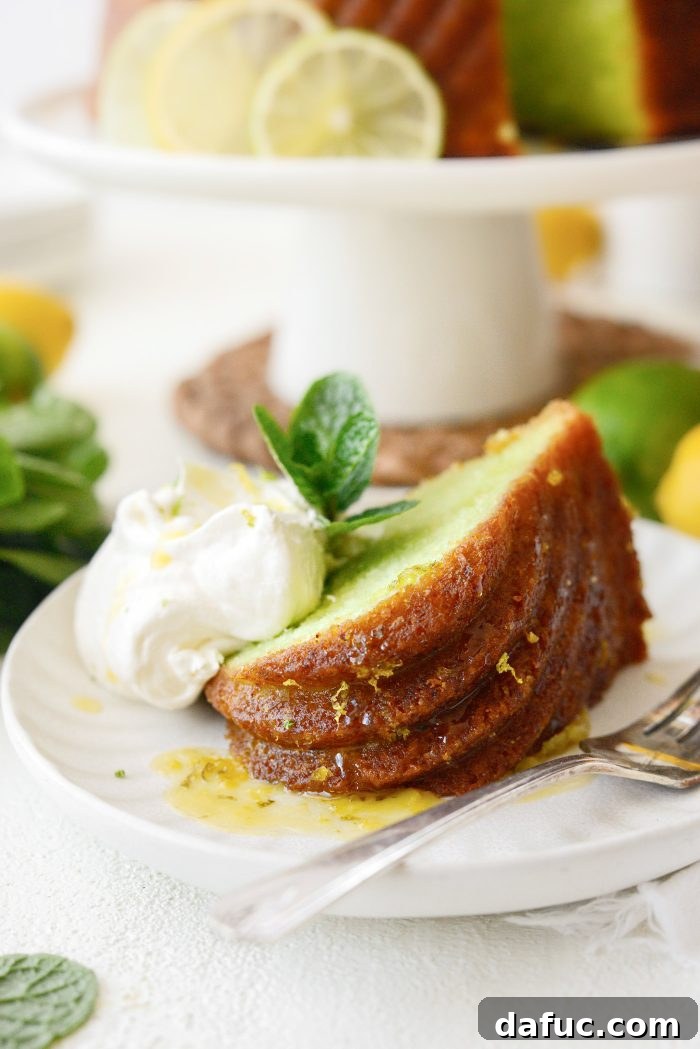 A close-up of the incredibly moist and fluffy Lemon Lime Bundt Cake, showcasing its vibrant color and perfect texture.