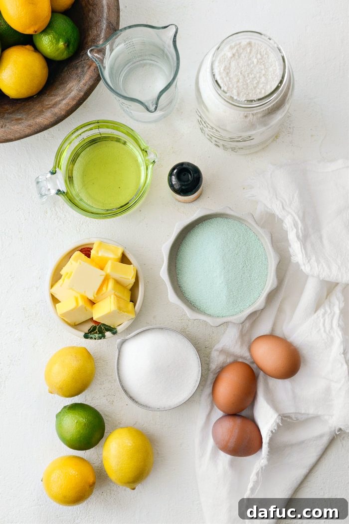 Key ingredients laid out for baking a Lemon Lime Bundt Cake, including fresh lemons and limes, butter, and cake mix.