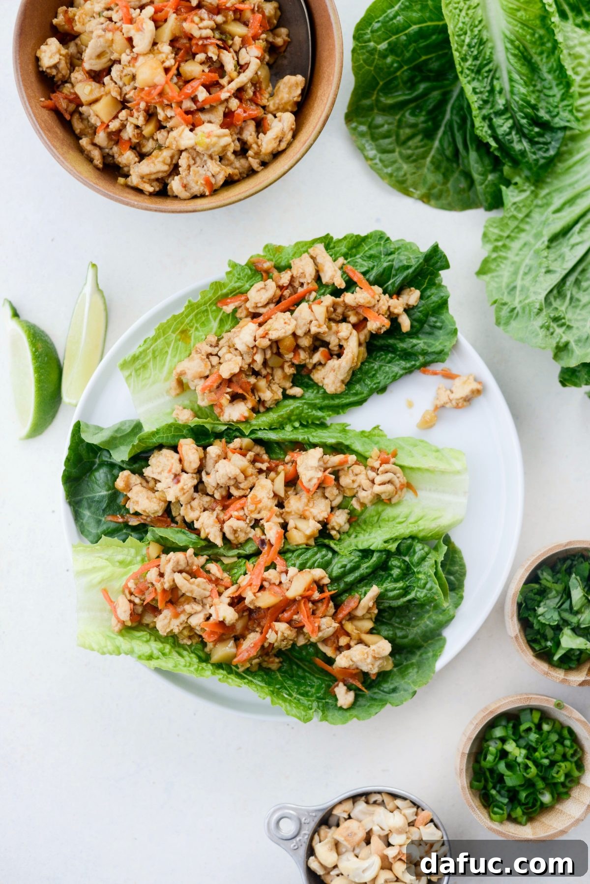 Vibrant Ginger Cashew Lettuce Wraps 11 Placing the ginger cashew turkey filling into romaine lettuce leaves