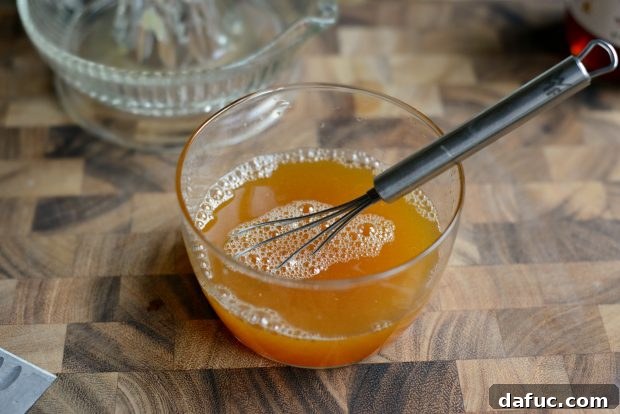 Prismatic Fruit Delight 9 Whisking honey into citrus juice
