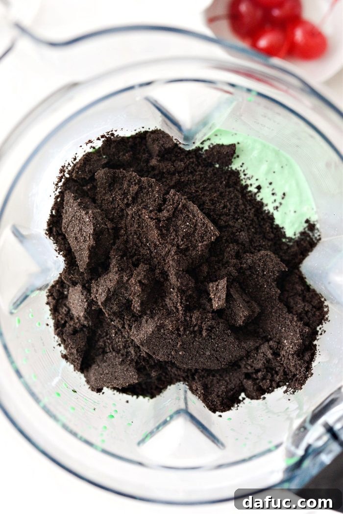 Adding cookie crumbs to the blended shake
