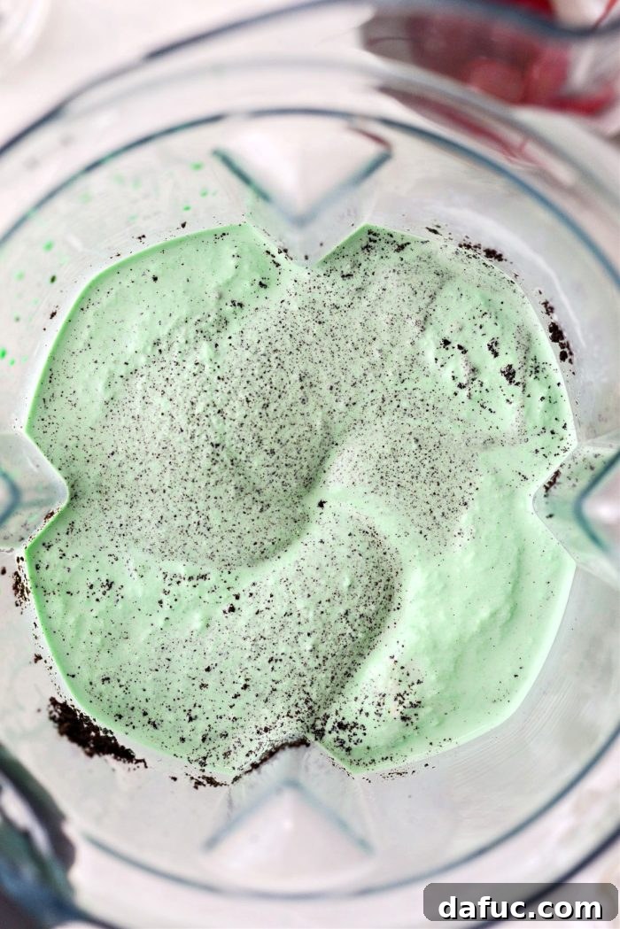 Pulsing the blender to combine cookie crumbs