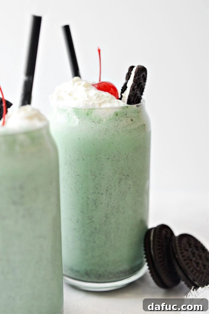 Cookies and Cream Shamrock Shake garnished with whipped cream and cookie crumbs
