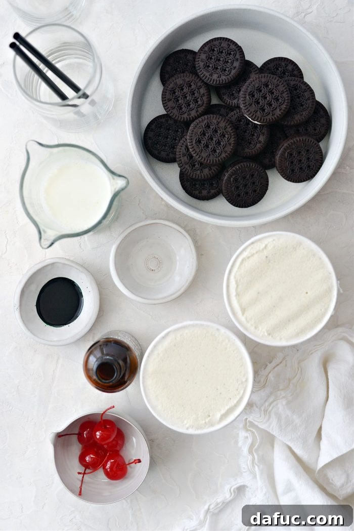Ingredients laid out for Cookies and Cream Shamrock Shake: cookies, extracts, milk, ice cream