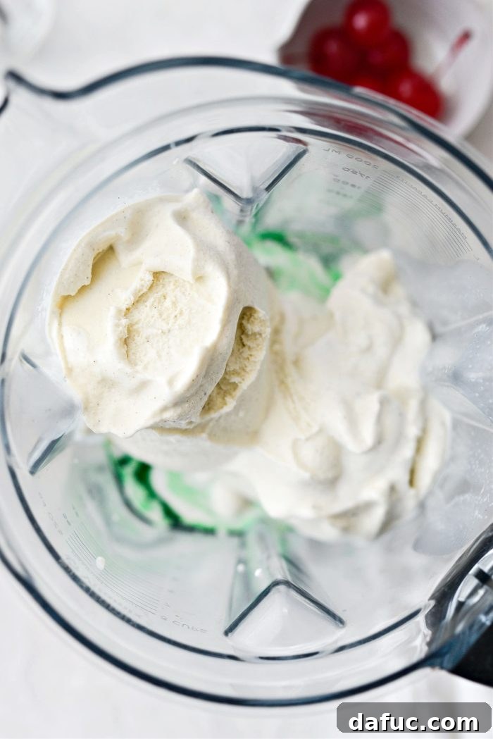 Adding softened vanilla ice cream to the blender