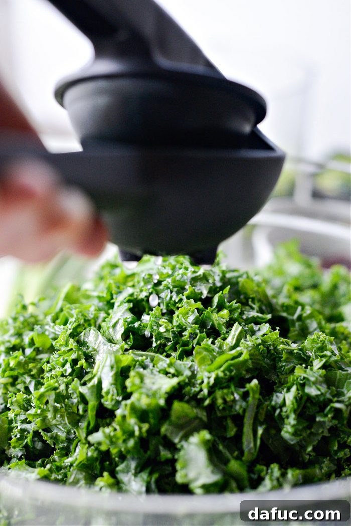 squeezing lemon on kale