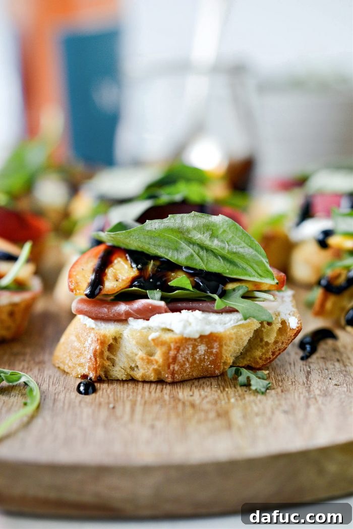 Peach Prosciutto Chèvre Crostini 2 Delicious Peach Prosciutto Goat Cheese Crostini arranged on a platter, perfect for a summer gathering