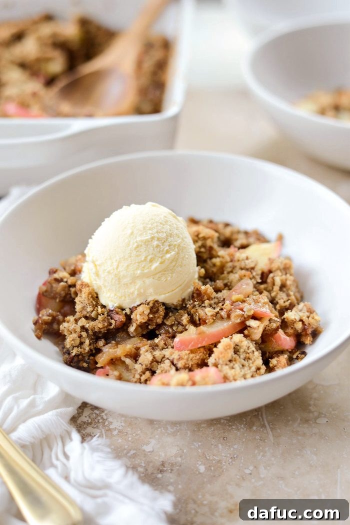 Effortless Apple Crumble 14 Easy apple crisp topped with a scoop of melting vanilla ice cream.