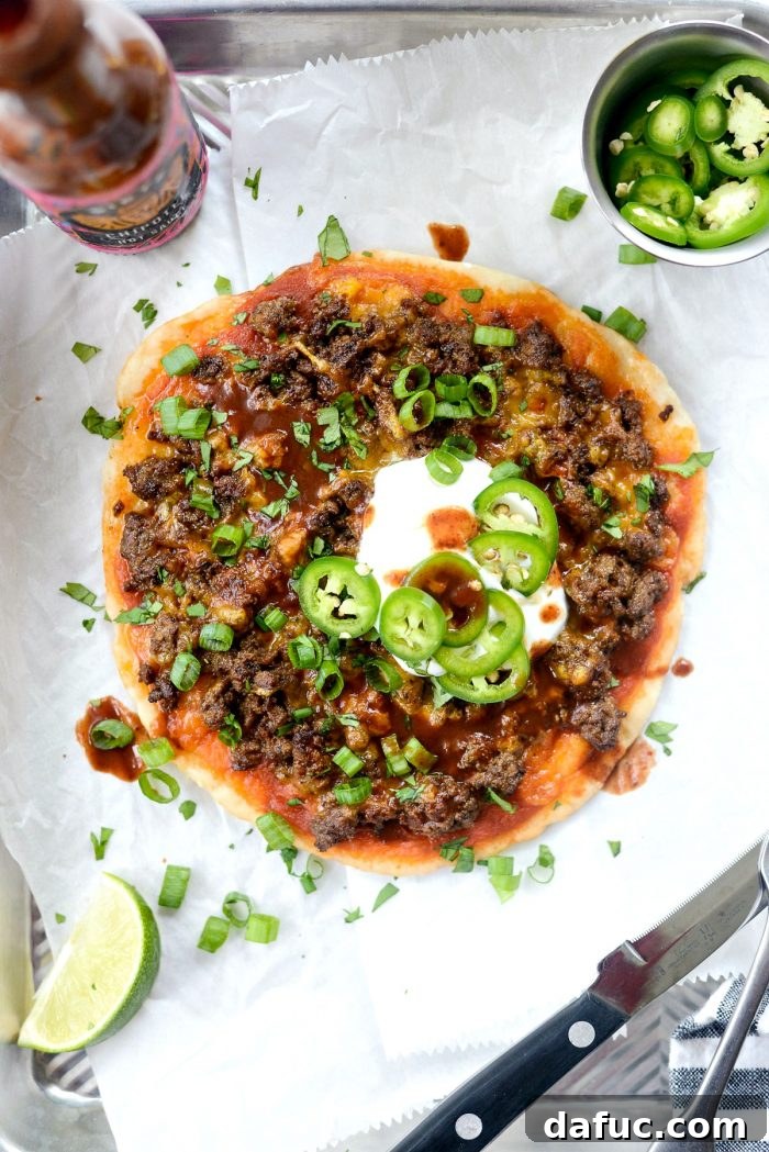Fiestadas - a homemade copycat Mexican pizza with taco beef and cheese on a thin crust