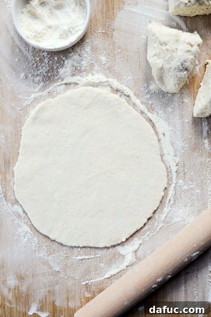 Rolling out pizza dough thinly for Fiestada crusts