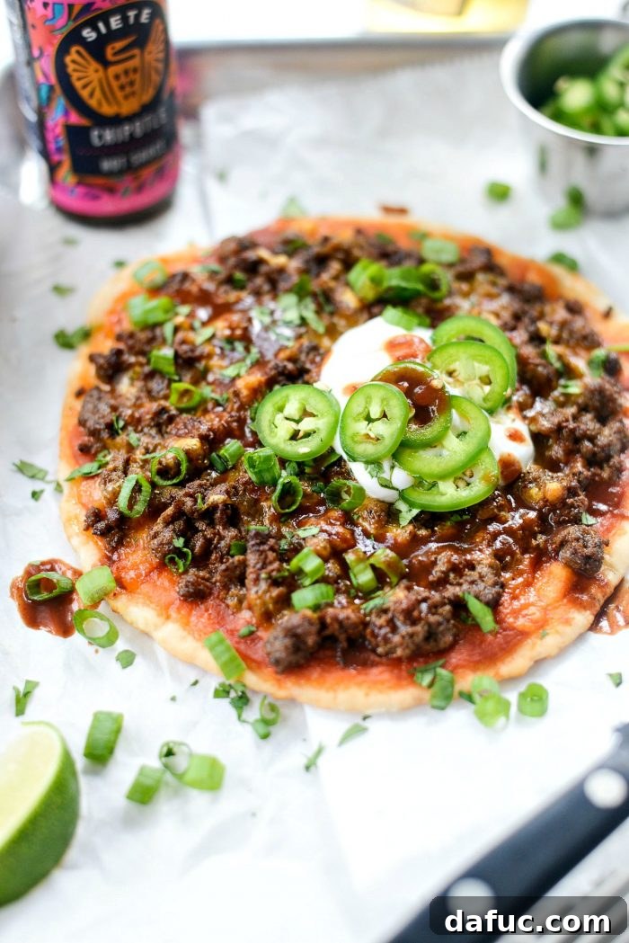 Classic Fiestadas recipe, a high school lunchroom favorite, topped with taco meat and cheese