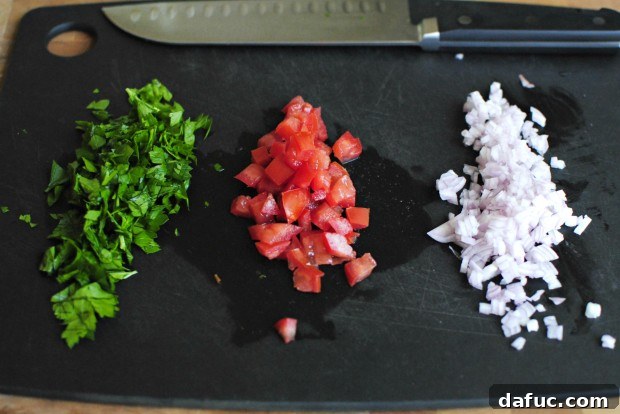 chop, dice, mince Hands chopping parsley, dicing shallots and roma tomatoes.