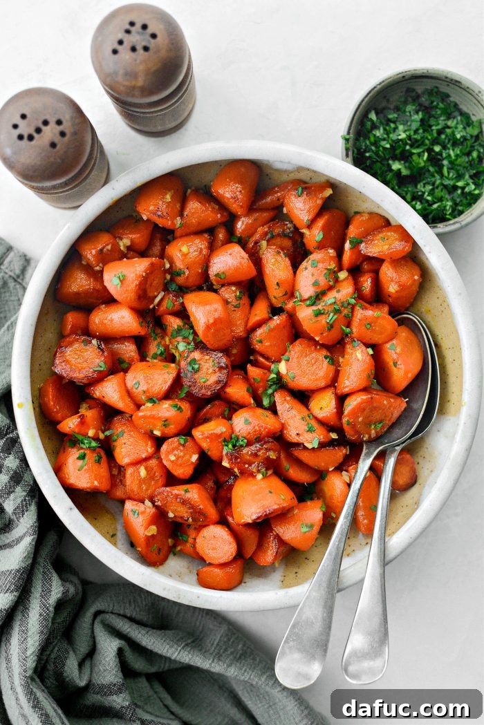 A bowl of delicious Maple Glazed Carrots ready to be served, garnished with fresh parsley
