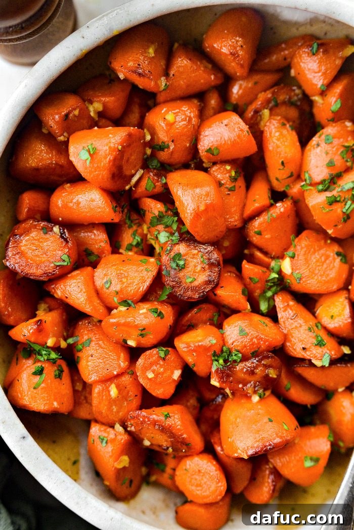 A final close-up of Maple Glazed Carrots in a bowl, perfectly glistening and ready to eat, with a subtle blur in the background