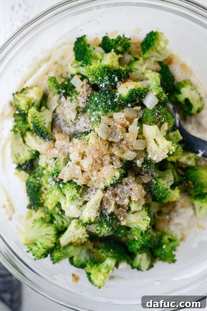Cozy Broccoli Bake 12 Adding broccoli mixture to creamy base and seasoning
