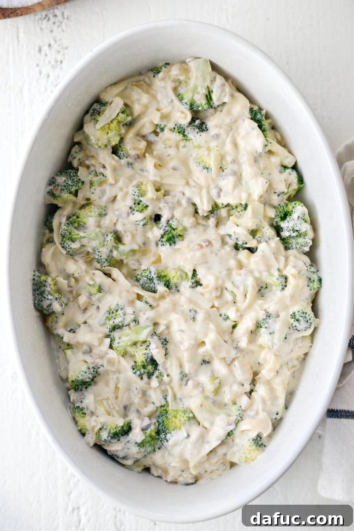 Cozy Broccoli Bake 14 Transferring creamy broccoli mixture to prepared casserole dish