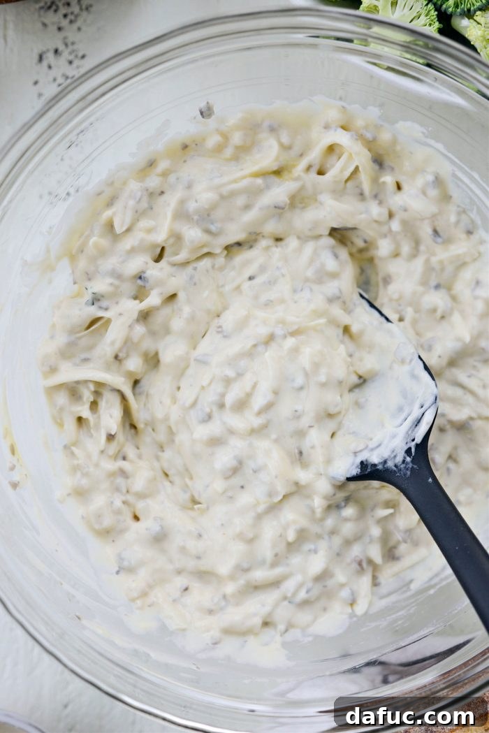 Cozy Broccoli Bake 7 Stirring the creamy sauce ingredients together