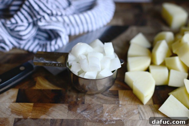 Diced russet potatoes on a cutting board