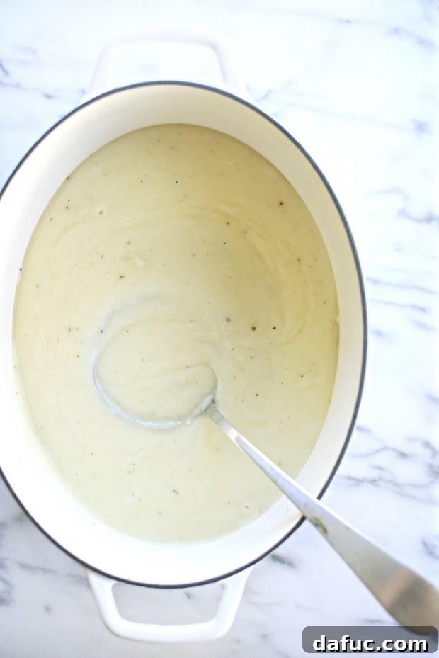 Roasted garlic potato soup in a pot