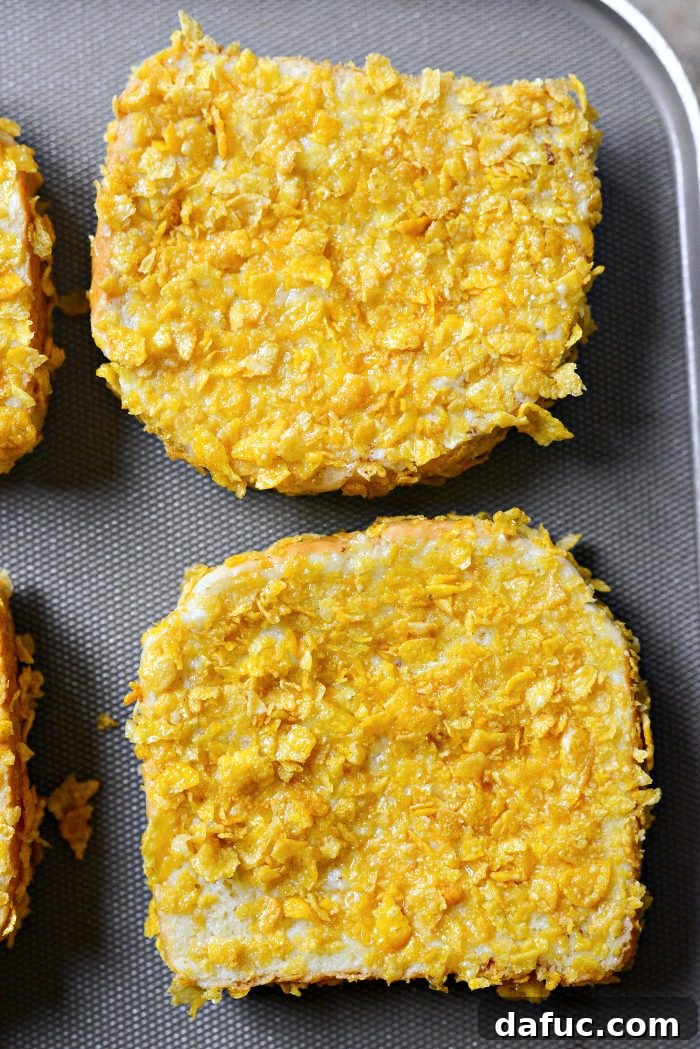 Crunchy Cornflake French Toast 12 Spraying French toast with ghee oil spray and placing on a preheated griddle