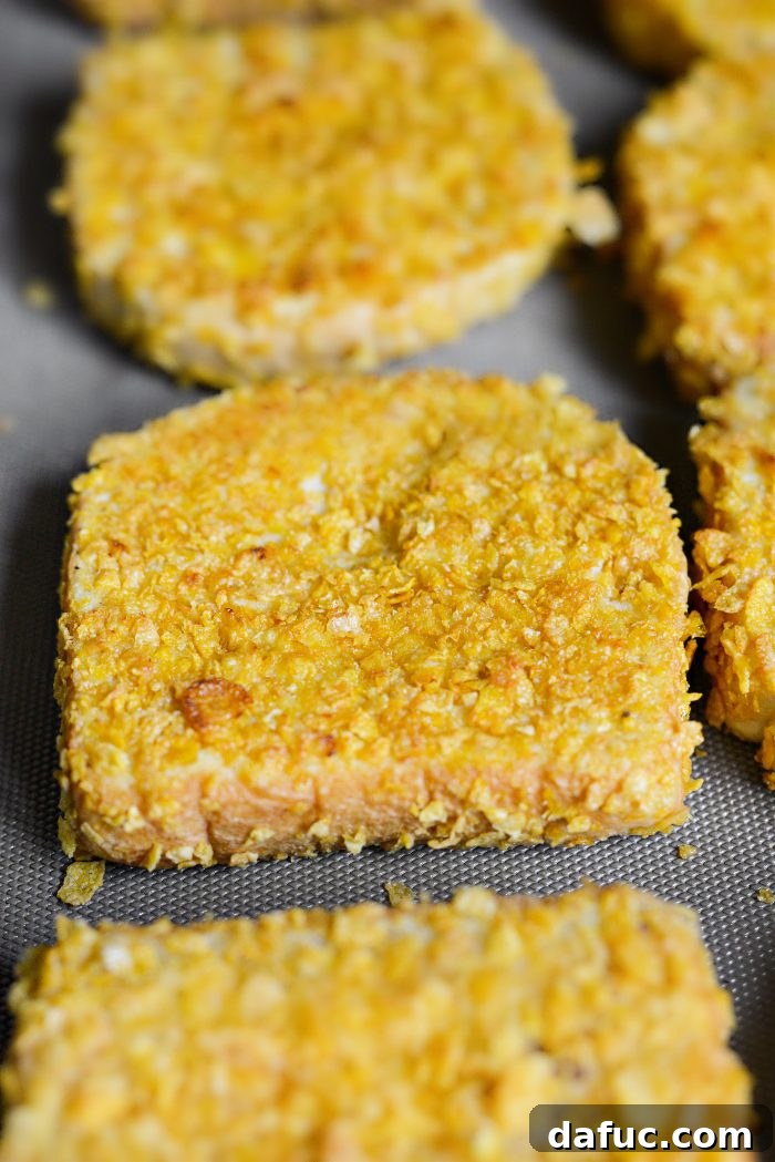 Crunchy Cornflake French Toast 13 Cooking Cornflake Crusted French Toast on a griddle, filling the surface