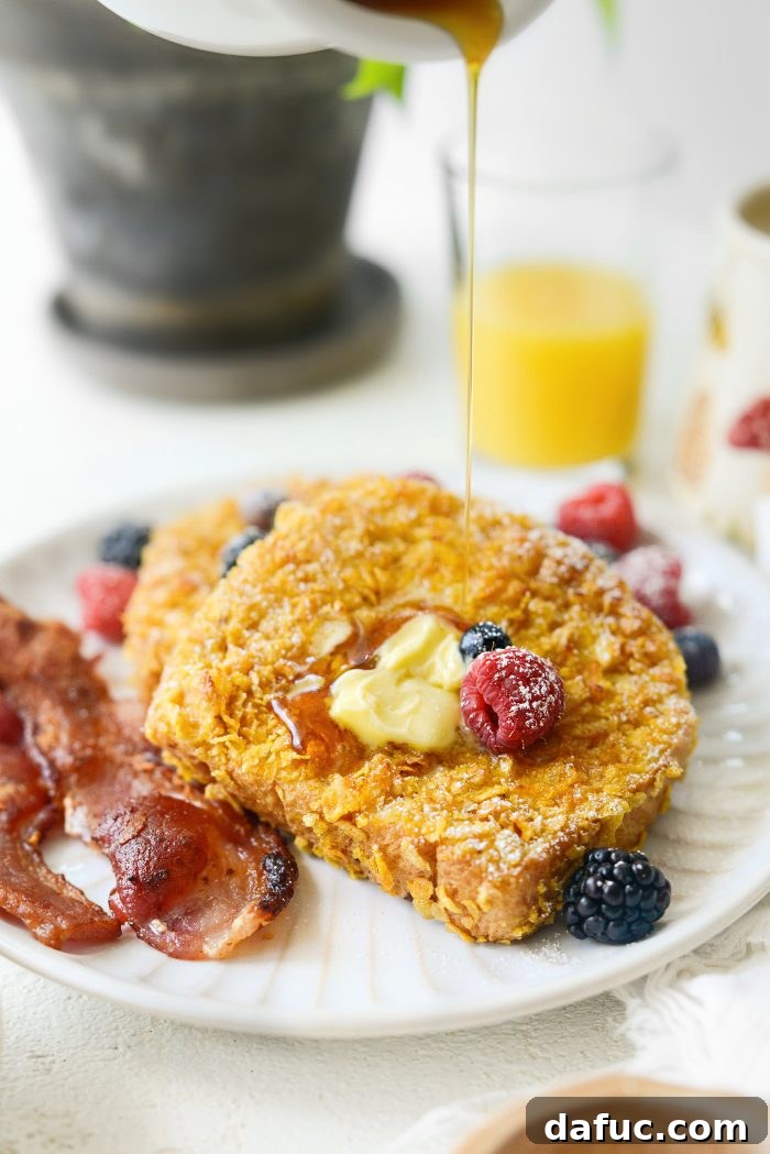 Crunchy Cornflake French Toast 15 Plated Cornflake Crusted French Toast with butter and maple syrup