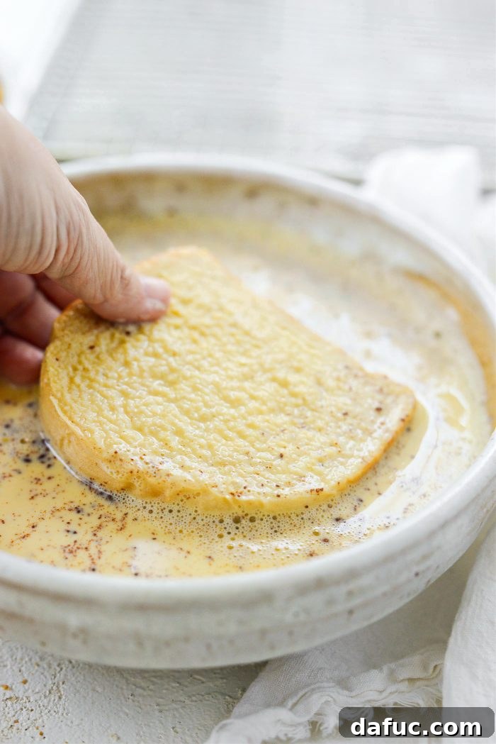Crunchy Cornflake French Toast 9 Dipping bread in egg batter on both sides for French toast