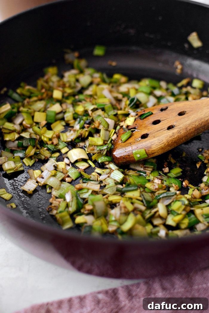 Slow-Braised Beef Short Ribs 11 Leeks and garlic softening in the pan with a pinch of salt, releasing their sweet aromas.