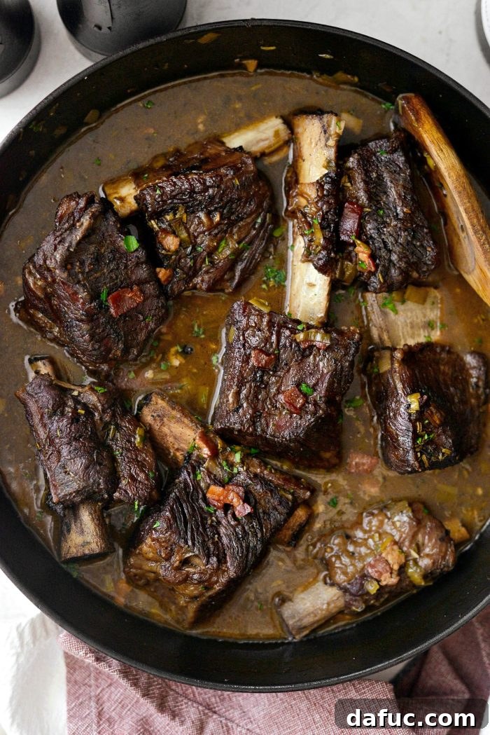 Slow-Braised Beef Short Ribs 20 Braised beef short ribs returned to the beautifully refined, bubbling gravy, ready for serving.