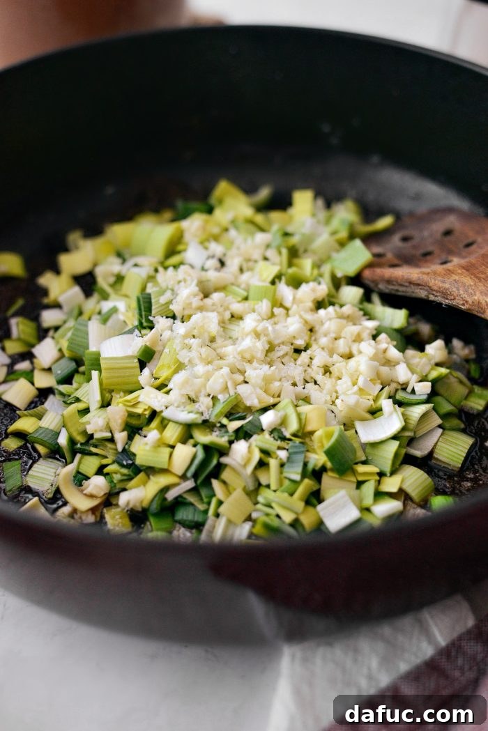 Add leeks and garlic to pan