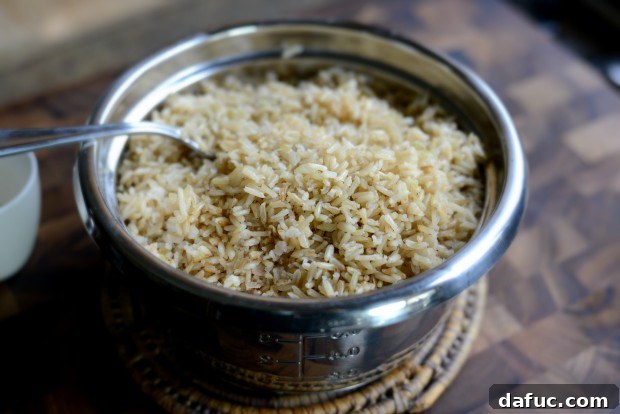 Fragrant Almond Basmati Pilaf 15 Fluffing cooked basmati rice with a fork