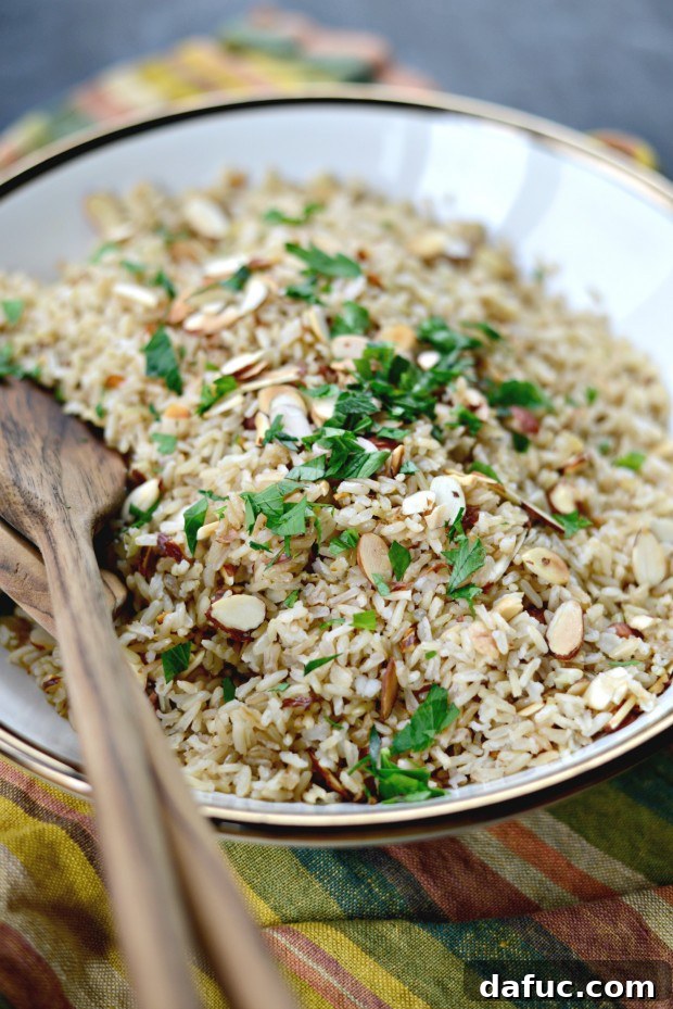 Fragrant Almond Basmati Pilaf 19 Garnishing Garlicky Toasted Almond Basmati Rice with fresh parsley