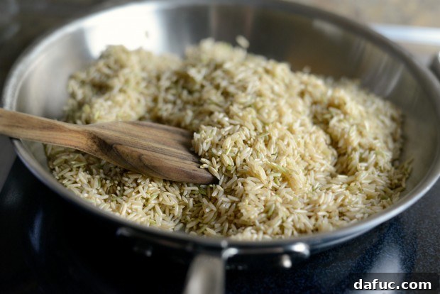 Fragrant Almond Basmati Pilaf 7 Stirring basmati rice as it toasts in a skillet