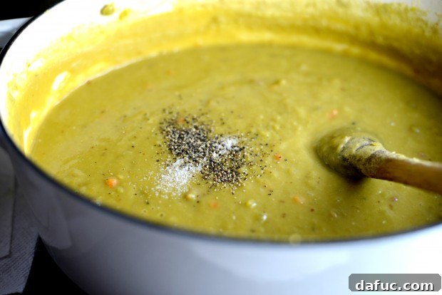 Seasoning the Split Pea Soup with salt and pepper