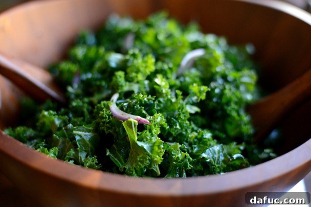 Pouring Hot Dressing over Kale and Onions