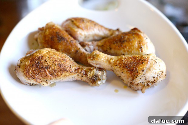 Slow-Simmered Chicken Stew 12 Seared chicken pieces on a clean platter