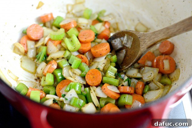 Slow-Simmered Chicken Stew 14 Stirring vegetables in the pot, scraping up browned bits