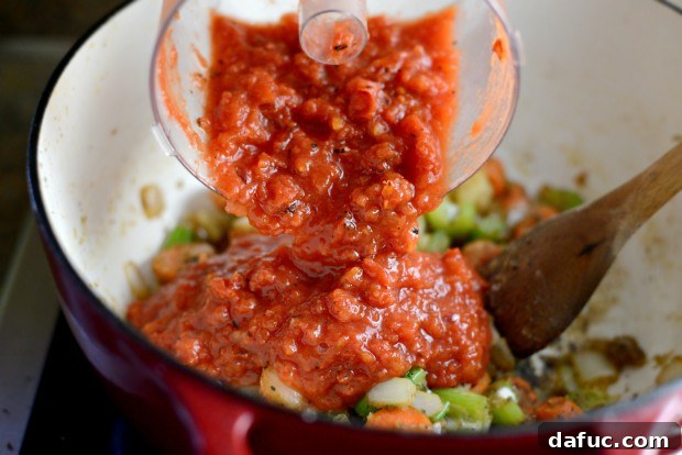 Slow-Simmered Chicken Stew 16 Pureed fire-roasted diced tomatoes poured into the pot
