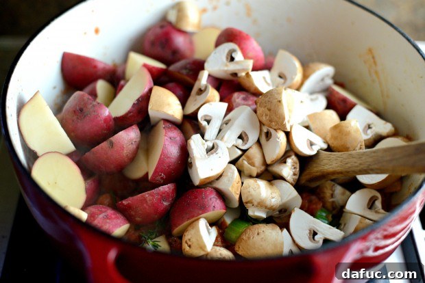 Slow-Simmered Chicken Stew 18 Baby redskin potatoes and mushrooms added to the pot