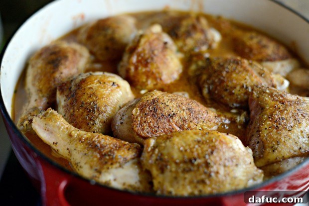 Slow-Simmered Chicken Stew 21 Seared chicken pieces placed on top of vegetables and liquids