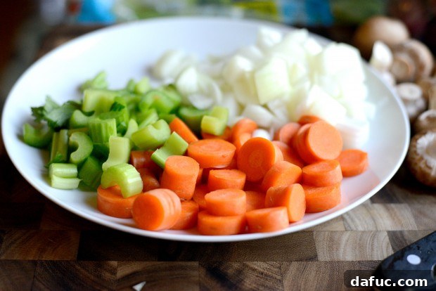 Slow-Simmered Chicken Stew 4 Prepping fresh vegetables for chicken stew: carrots and celery