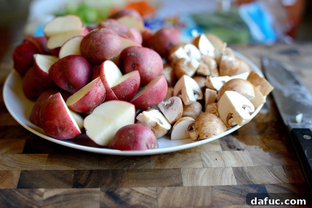 Slow-Simmered Chicken Stew 5 Halved baby redskin potatoes and quartered cremini mushrooms